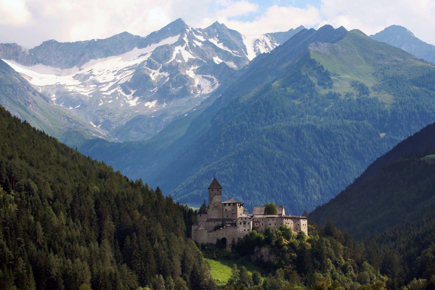 The medieval castle of Taufers with beautiful Dolomites mountains in the background