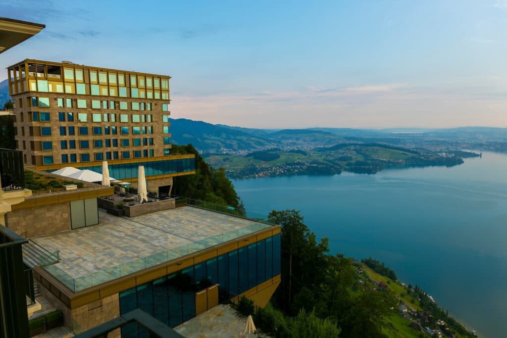 Hotel Five Stars Bürgenstock over Lake Lucerne and Mountain with Sunlight in Bürgenstock, Nidwalden, Switzerland.